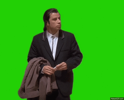 Man in Suit Holding Jacket Over Shoulder