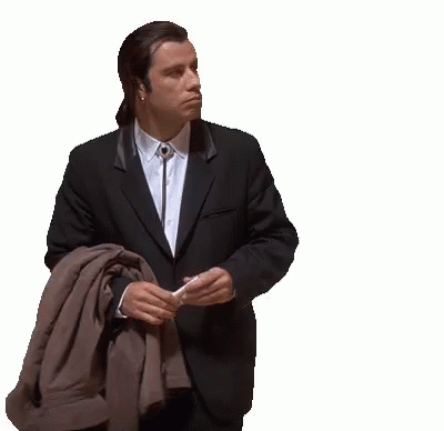 Man in Suit Holding Jacket Over Shoulder