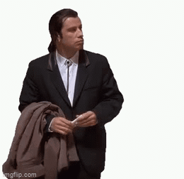 Man in Suit Holding Jacket Over Shoulder
