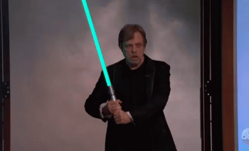 Man in Suit Holding Light Saber