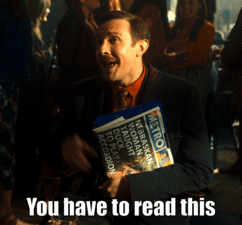 Man in Suit Holding Metro Newspaper
