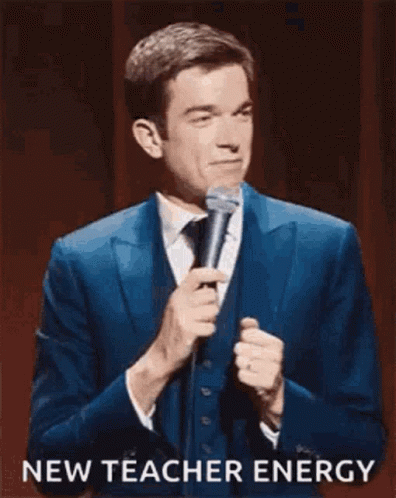 Man In Suit Holding Microphone GIF