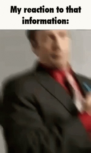 Man in Suit Holding Microphone Talking