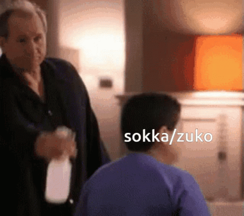 Man In Suit Holding Milk Bottle GIF