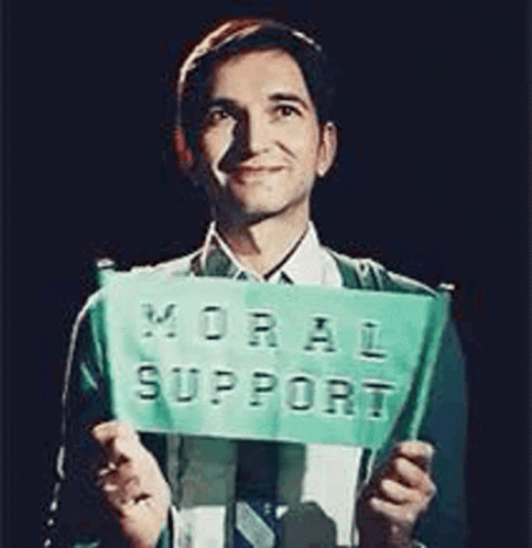 Man In Suit Holding Moral Support Sign GIF