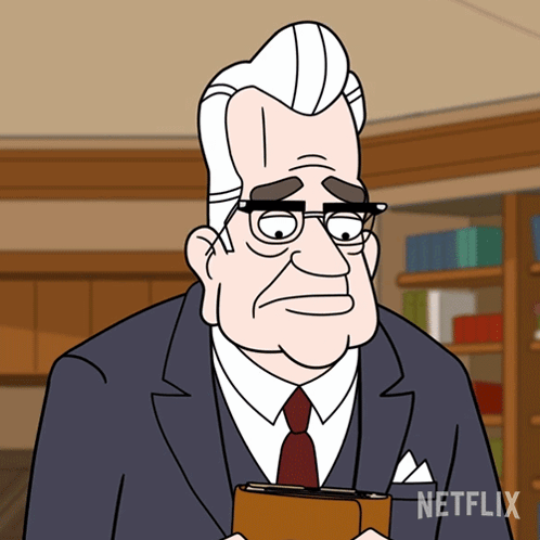 Man In Suit Holding Netflix Book GIF