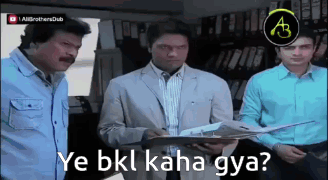 Man in Suit Holding Paper Saying Ye Bkl Kaha Gya
