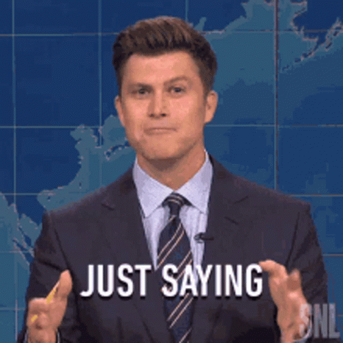 Man in Suit Holding Pencil Says Just Saying