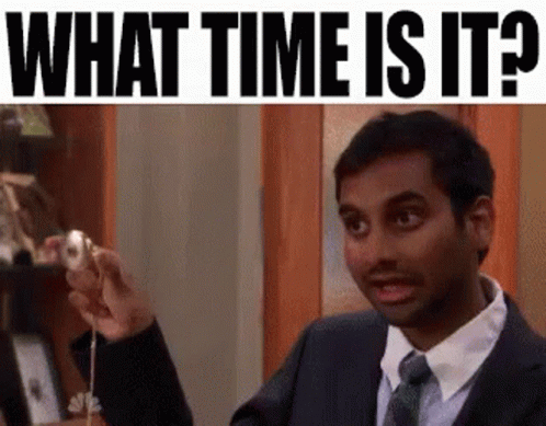 Man In Suit Holding Pendulum Asking Time GIF