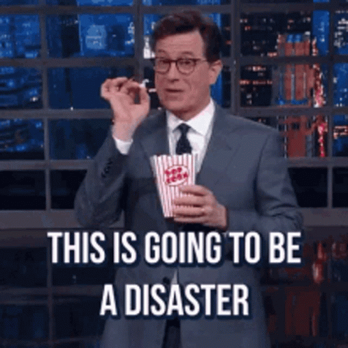 Man in Suit Holding Popcorn This Is Disaster