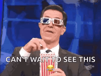 Man in Suit Holding Popcorn With 3D Glasses