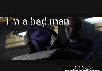 Man in Suit Holding Purple Bag Saying I'm a Bad Man