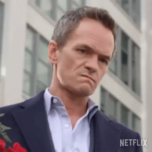 Man in Suit Holding Rose