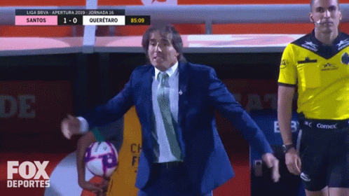 Man in Suit Holding Soccer Ball Fox Deportes Ad