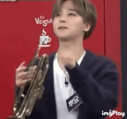 Man In Suit Holding Trumpet Funny Face GIF