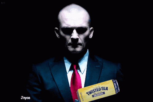 Man in Suit Holding Twisted Tea