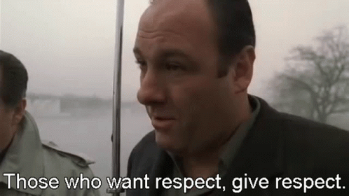 Man In Suit Holding Umbrella Saying Respect GIF