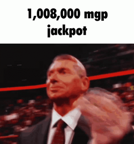 Man In Suit Holding Up Fist Saying Jackpot GIF