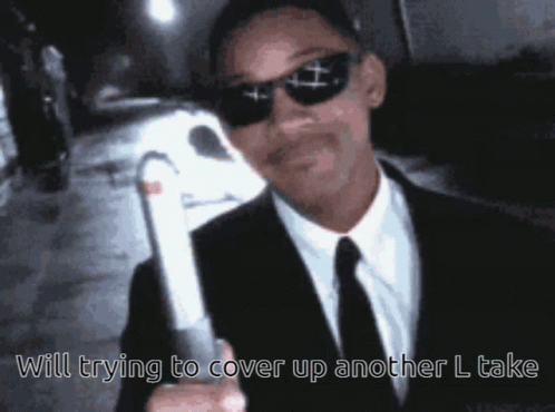 Man in Suit Holding White Object Saying Will Trying to Cover Up Another L Take