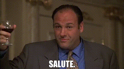 Man In Suit Holding Wine Glass GIF