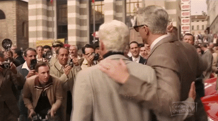 Man In Suit Hugging Man Crowd Cinnamon Chopsticks GIF