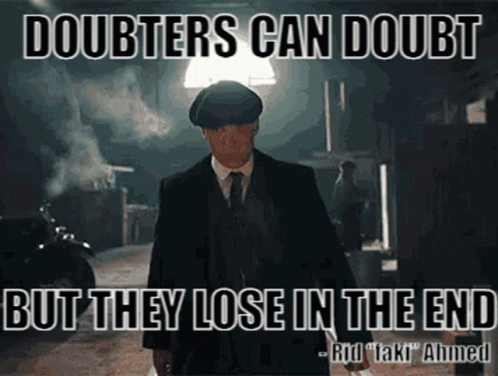 Man in Suit in Dark Alleyway Quote About Doubters