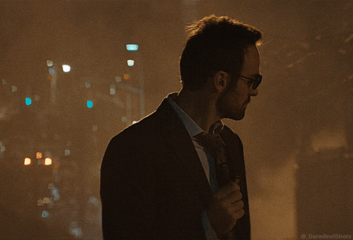 Man in Suit in Dark Alleyway With Daredevilshots