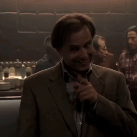 Man in Suit in Dark Room