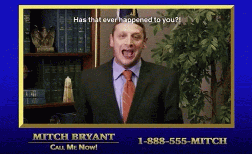 Man in Suit in Front of Bookshelf Saying Has That Ever Happened to You