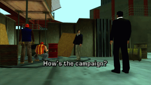 Man in Suit in Front of Construction Workers How's the Campaign
