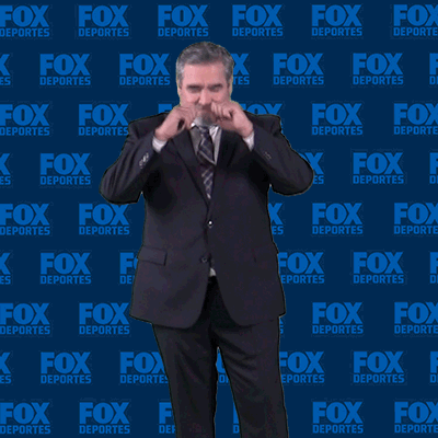 Man In Suit In Front Of Fox Deportes Wall GIF