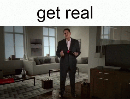 Man in Suit in Living Room Get Real