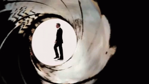Man in Suit in Middle of Gun Barrel