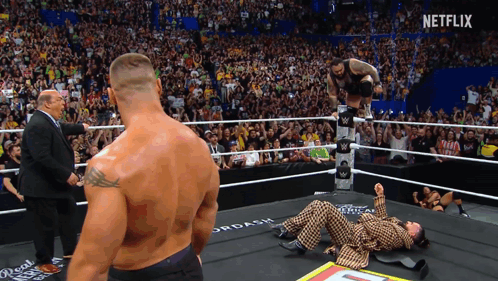 Man in Suit in Wrestling Ring With Netflix
