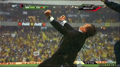 Man In Suit Jumping At Coca-Cola Soccer Game GIF