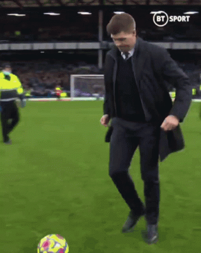 Man In Suit Kicking Soccer Ball GIF