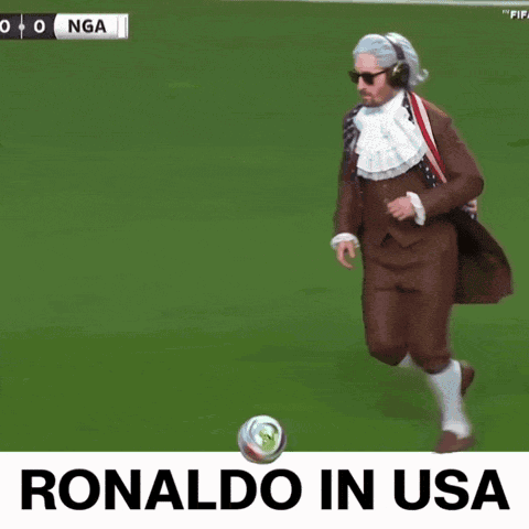 Man In Suit Kicking Soccer Ball Ronaldo In USA