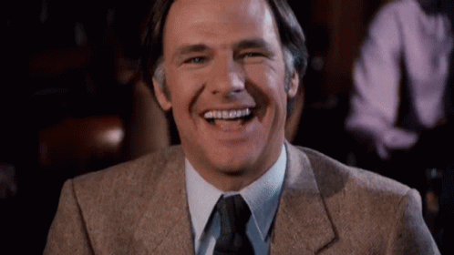 Man in Suit Laughing and Smiling