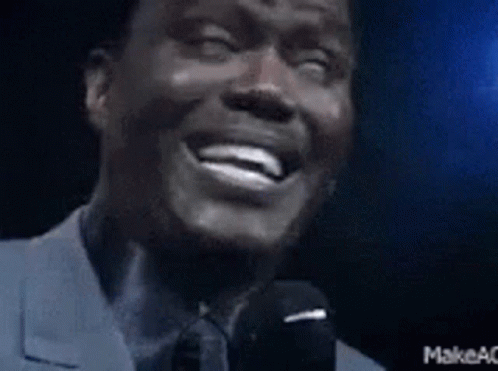Man in Suit Laughing and Speaking