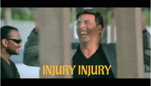 Man In Suit Laughing At Injury Injury Sign GIF