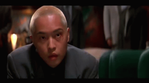 Man In Suit Looking At Camera GIF