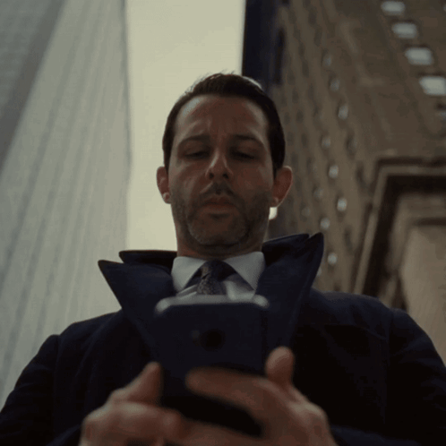 Man In Suit Looking At Cell Phone GIF