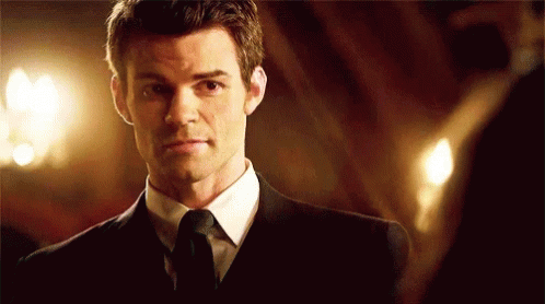 Man In Suit Looking At Mirror GIF