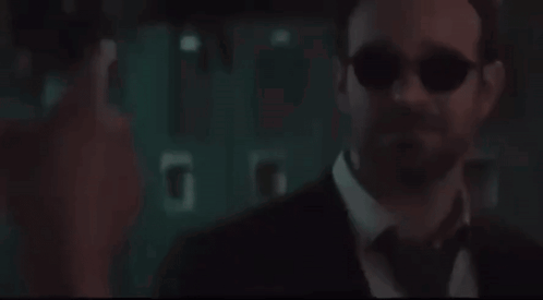 Man in Suit Looking at Screen