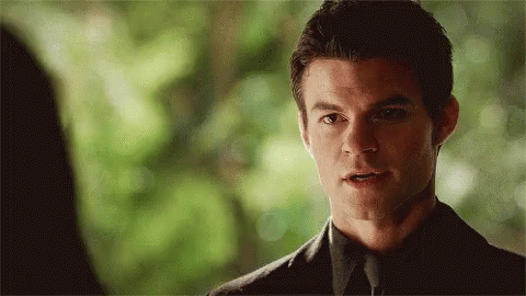 Man In Suit Looking At Woman GIF