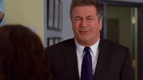 Man in Suit Looking at Woman