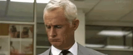 Man in Suit Looking Down