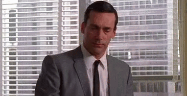Man In Suit Looking Out Window GIF