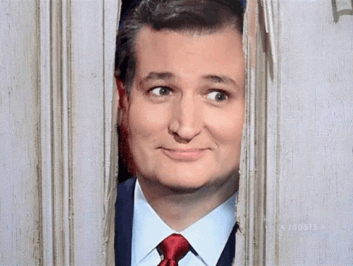 Man in Suit Looking Through Window