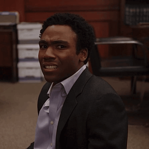 Man in Suit Making a Face